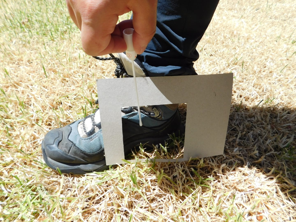 Person swabbing a hiking boot