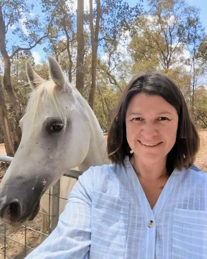 Jo Devlin and white horse.